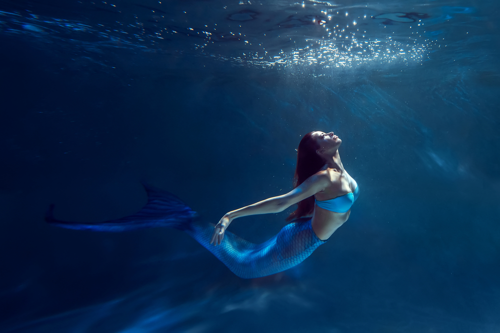 Freediver girl with mermaid tale