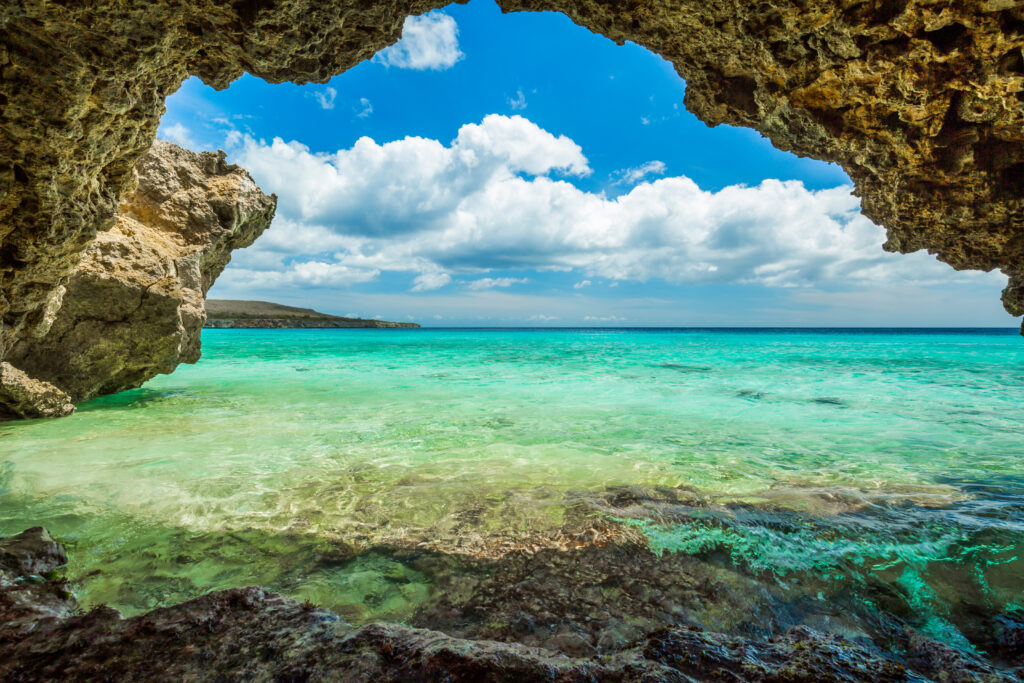 a view of the water from a beach in curacao
