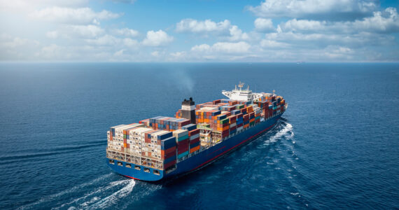 a massive container ship traversing the ocean