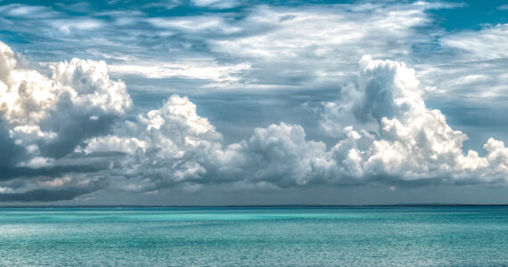 a view of the clouds over the ocean