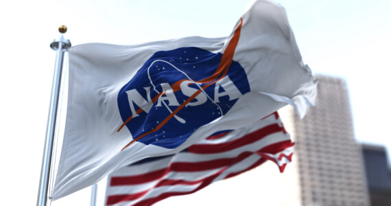 a nasa flag flying on a pole
