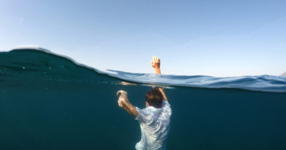 person drowning in the ocean