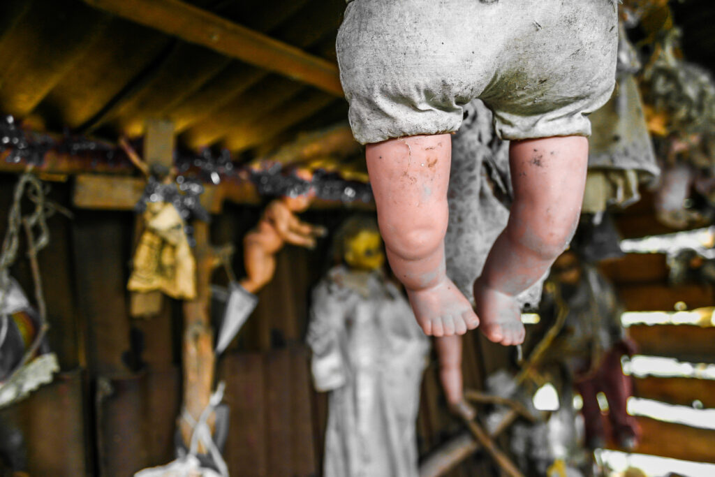a doll hanging in a hut on an island in mexico