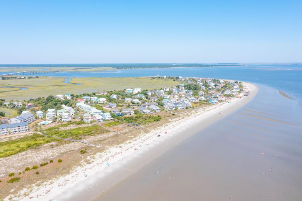 Aerial view of Harbor Island, South Carolina, showcasing a quiet coastal community with sandy beaches, salt marshes, and untouched natural surroundings, ideal for peaceful getaways, nature walks, and birdwatching.