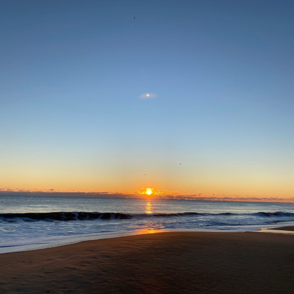 Sunset and moon over the Chesapeake Bay, Cape Charles, Virginia, winter 2021