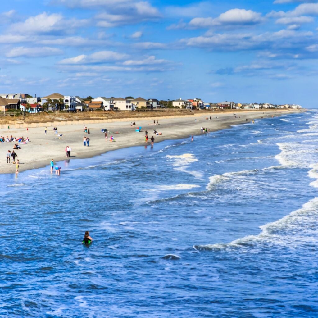 FOLLY BEACH, SC/USA - MARCH 30, 2015: Residents and tourists flock to the Atlantic Ocean at Folly Beach, also known as the "edge of America," near Charleston in South Carolina.