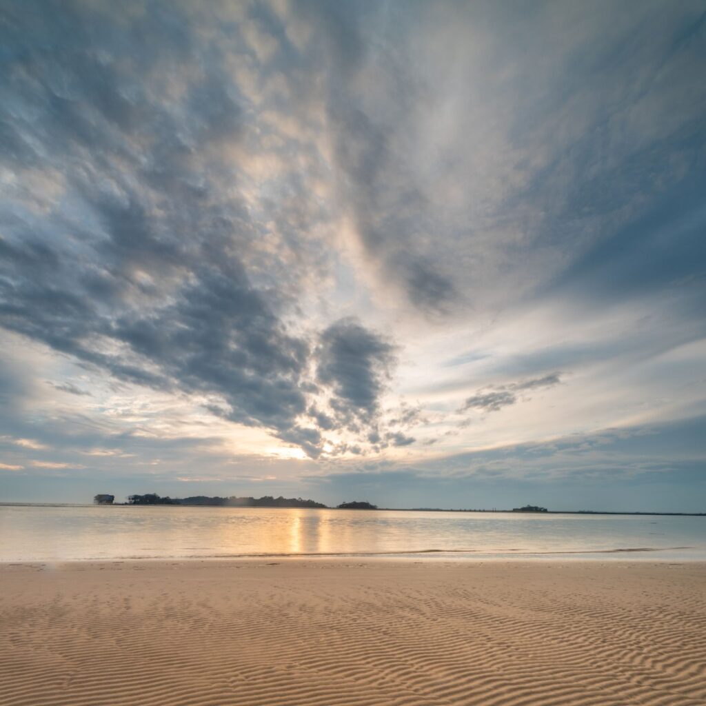 Gorgeous long exposure of the sunset on Fripp Island beach showing movement of the clouds.