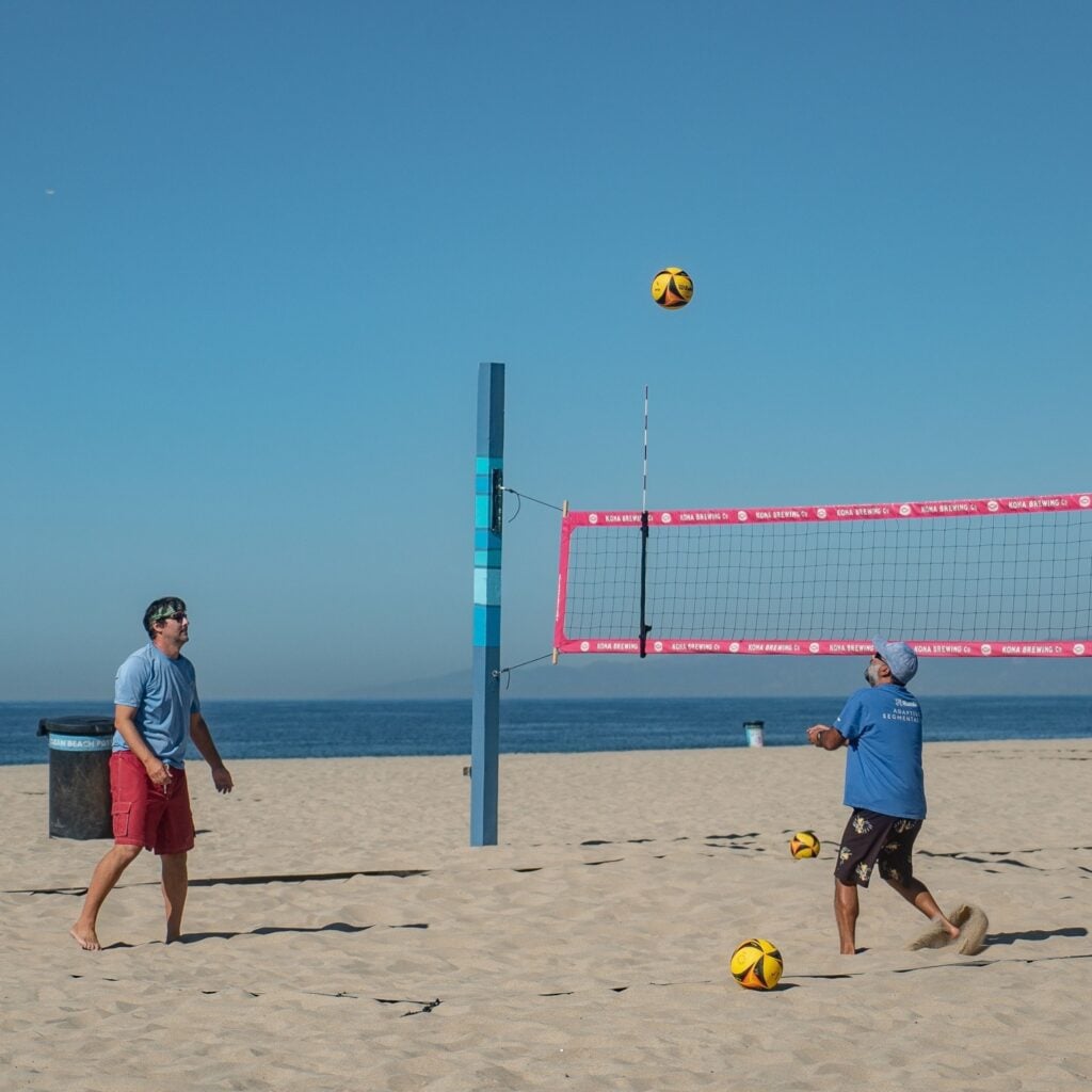 Hermosa Beach, California - United States. 10-25-2022 . Two men playing beach volley in Hermosa Beach.
