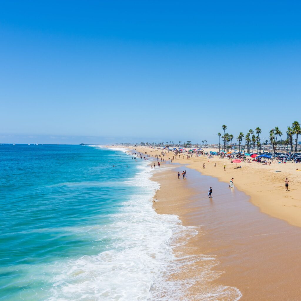 Newport Beach , CA USA - July 18, 2019: Balboa boardwalk and Balboa Island area of Newport Beach with tourist activities for shopping, eating, walking and enjoying the island, bay, beach, and pier.