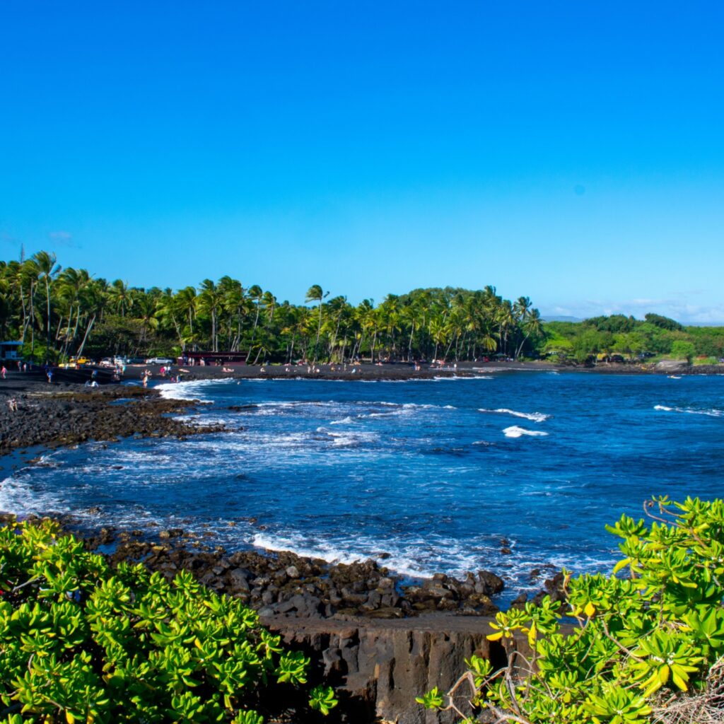 Sunny day at Punalu'u Black Sand Beach on the Big Island. Island of Hawaii, Hawaii, USA.