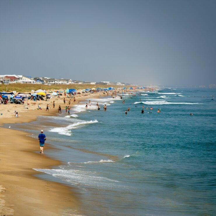 Virginia Beach, Virginia, USA - August 27, 2024: People enjoying the summer at the beach at Sandbridge.