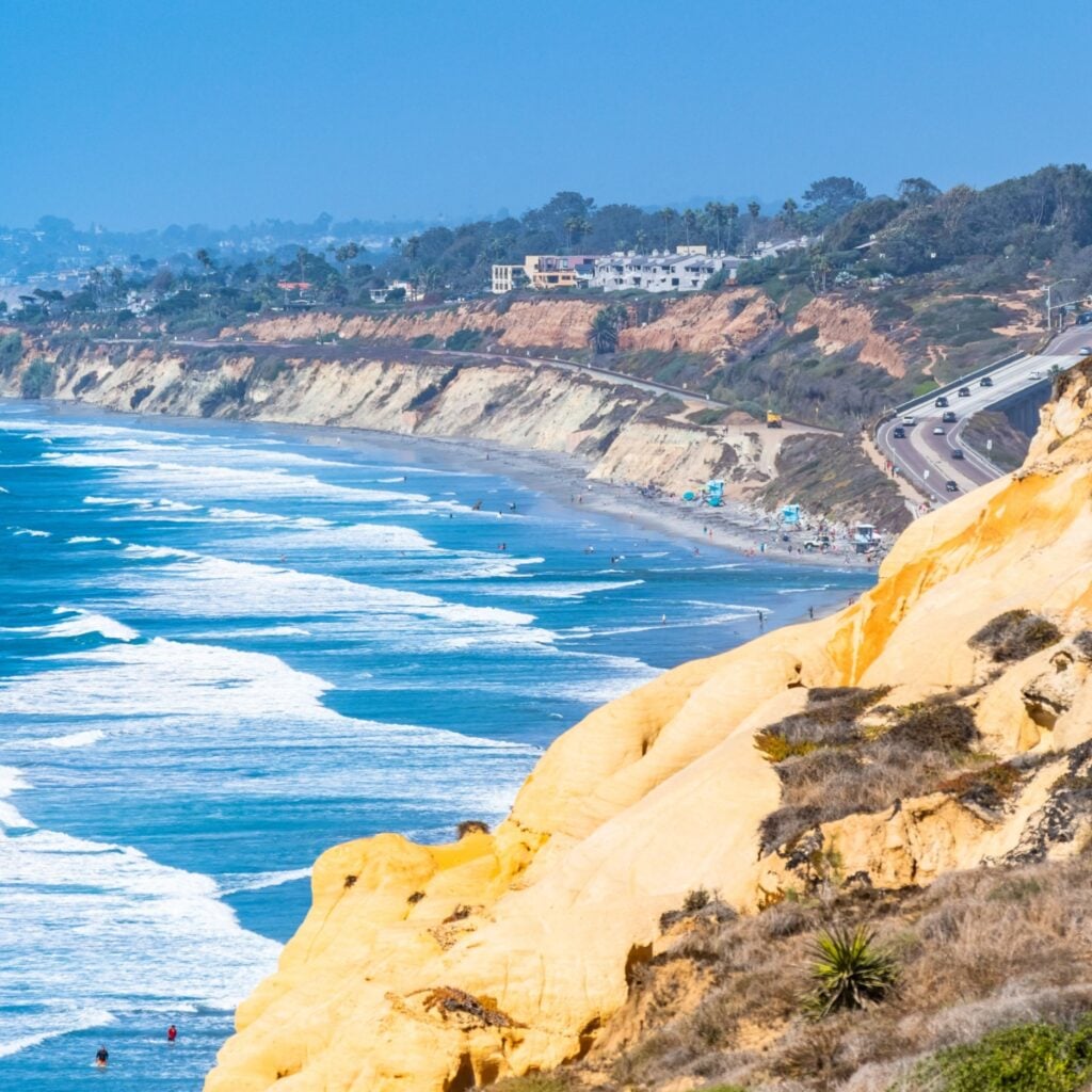 View from the sandstone cliffs above the Torrey Pines State Reserve and Beach on the coastline of La Jolla, San Diego, on the west coast in southern California on a beautiful sunny summer day.