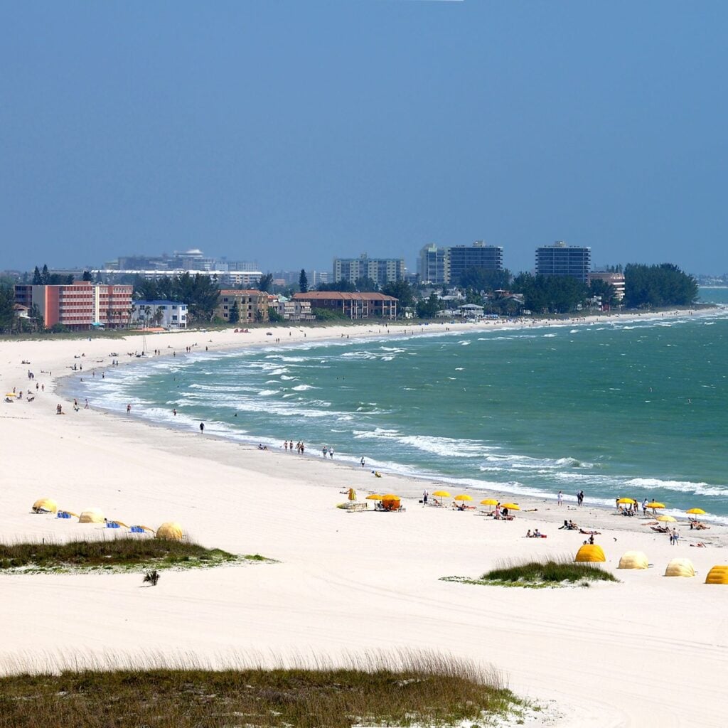 Aerial view of Treasure Island beach with waves breaking in the surf.