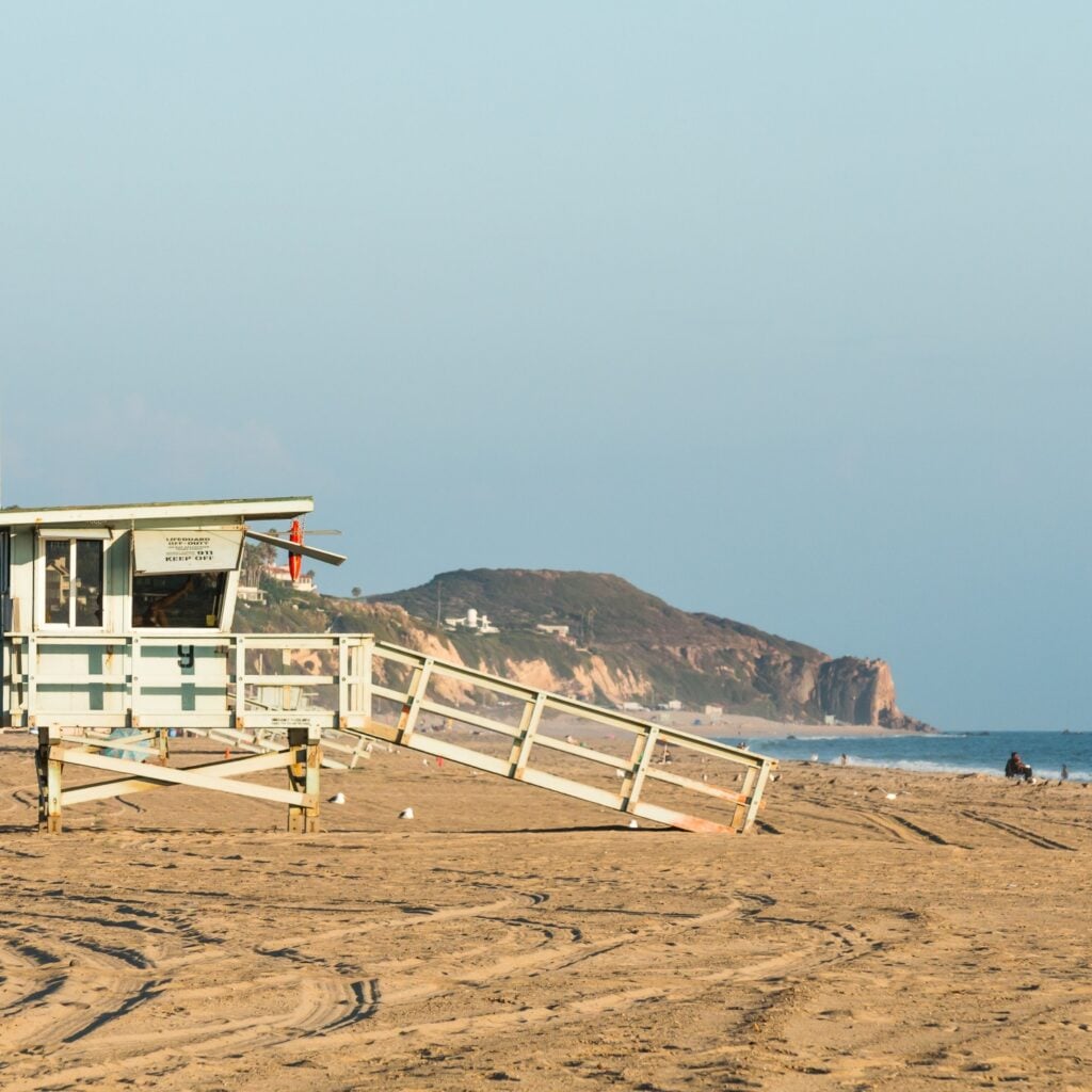 Lifeguard tower near sunset on Zuma Beach in Malibu, California.