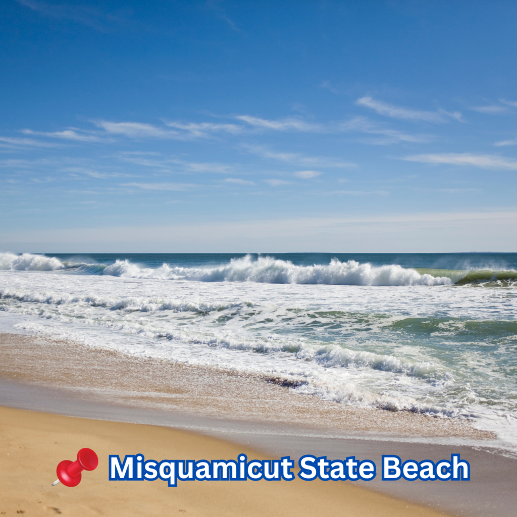 Waves crash onto the golden sand at Misquamicut State Beach in Westerly, RI, under a bright blue sky with light wispy clouds across the horizon.